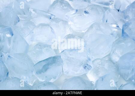 Ice cubes background texture with soft blue glowing Stock Photo