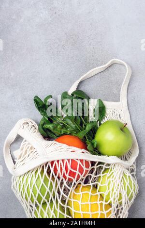 Zero Waste Shopping Bag With Fruits On Grey Concrete Background. Copy Space For Text Or Design Stock Photo