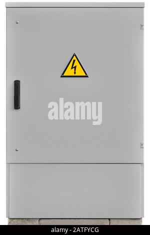 Power distribution wiring switchboard panel outdoor unit, grey brand new distributing board compartment box, gray cabinet, yellow high voltage warning Stock Photo