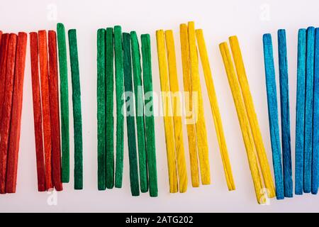 Sticks of various colors on awhite background Stock Photo