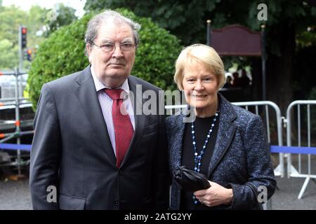 Former Northern Ireland's SDLP Leader John Hume and his wife Pat arrive for the funeral of the fomer Taoiseach (Irish Prime Minister) Albert Reynolds at the Sacred Heart Church in Donnybrook in Dublin, Monday August 25, 2014. Mr Reynolds died last Thursday aged 81 after a long illness. Taoiseach Enda Kenny, President Michael D Higgins and several serving and past politicians attended the funeral mass. The State funeral was Mr Reynolds, who is survived by his wife Kathleen, two sons and five daughters, will be buried with full military honours at Shanganagh Cemetery in south Dublin. Photo/Paul Stock Photo