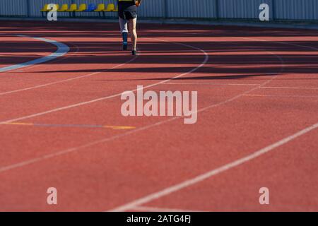 Stadium track and running athlete with disability Stock Photo