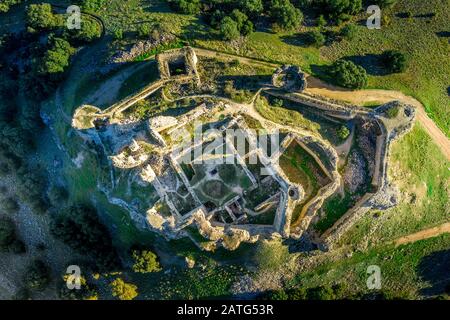 Aerial view of medieval castle ruin Pueble de Almenara in Cuenca Spain with convenctric walls, semicircular towers and angle bastions Stock Photo