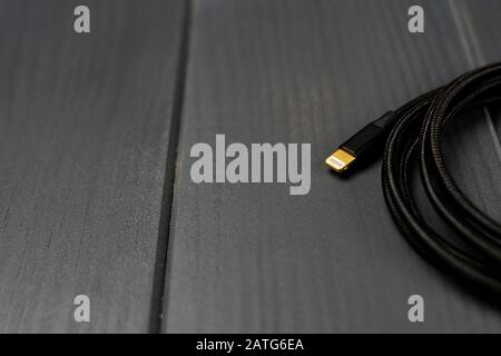 Cable with lighting type terminal for connection with electronic devices Stock Photo