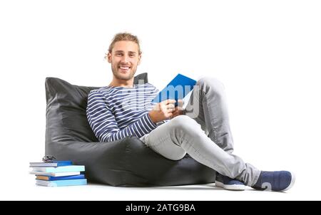 Handsome man reading book on white background Stock Photo