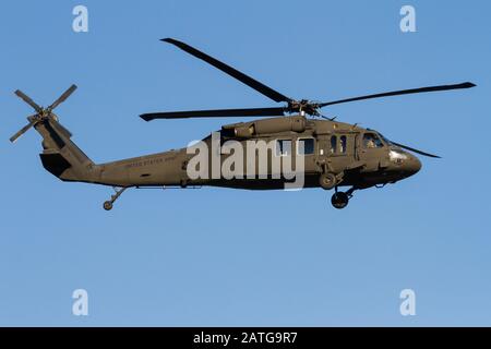 A US Army Sikorsky UH-60 Black Hawk helicopter coming in to land at Naval Air Facility, Atsugi airbase, Kanagawa, Japan. Stock Photo