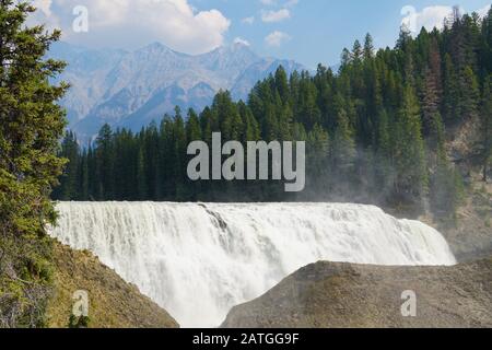 View to the face of Wapta Falls and the beautiful Canadian Rockies in Yoho National Park. Stock Photo