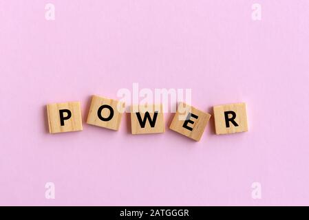 Power text wood blocks. Pink background. Stock Photo