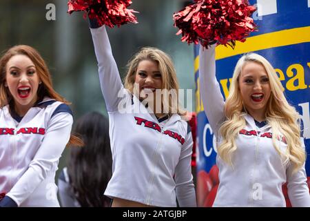 Houston, Texas, USA - November 28, 2019: H-E-B Thanksgiving Day Parade, The Texans cheerleaders waving and smiling at the spectators Stock Photo