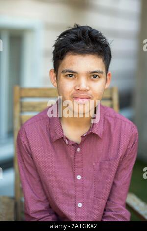 Young mixed race teenage boy looking at the camera