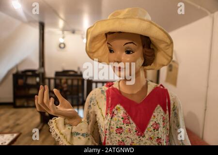 Female mannequin in casual clothing and hat from the 1980s. A wax figure of a housewife. Wax figure installation. Woman in the house Stock Photo