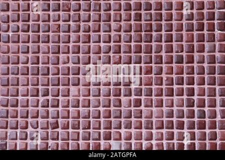 Wall with square tiles of brown color. Floor texture with small tiles Stock Photo