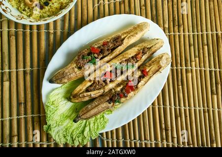 Puerto Rican  Stuffed Baked Plantains, roasted plantains filled with seasoned ground meat, tomatoes, onions, bell pepper, and spices Stock Photo