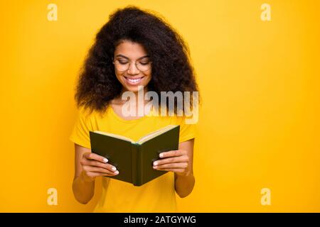 Close-up portrait of her she nice attractive lovely brainy cheerful cheery wavy-haired girl reading novel visit library isolated over bright vivid Stock Photo