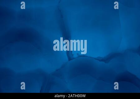 Abstract marble background in blue trendy colors. Texture of marble surface great for design. Close up. Stock Photo
