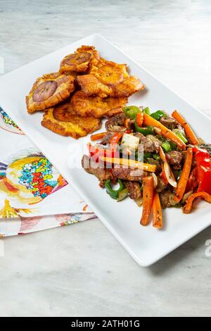 Chopped steak or Bistec Picao and patacones or tostones are fried green plantain slices, made with green plantains, Tipical Panamá food, Panamá, Centr Stock Photo