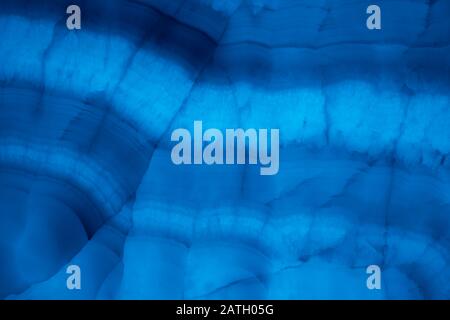 Abstract marble background in blue trendy colors. Texture of marble surface. Place for design. Close up. Color of the year 2020. Stock Photo