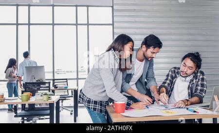 Creative designe team brainstrom branding project with designer team at meeting table with desktop computer.discussion idea in creative office Stock Photo