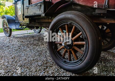 A collection of rusty antique wheels in reclaim yard Stock Photo - Alamy