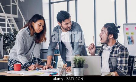 Creative designe team brainstrom branding project with designer team at meeting table with desktop computer.discussion idea in creative office Stock Photo