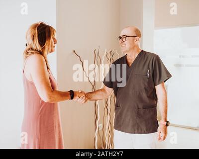 The doctor receives his patient at the clinic Stock Photo