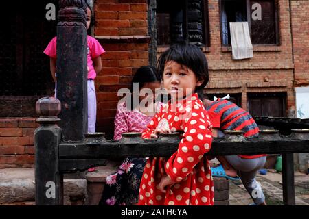 Child playing around a little stupa in kathmandu valley Stock Photo