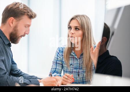 close up. two employees sitting at the Desk Stock Photo