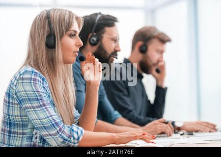 young call center employee in the workplace Stock Photo