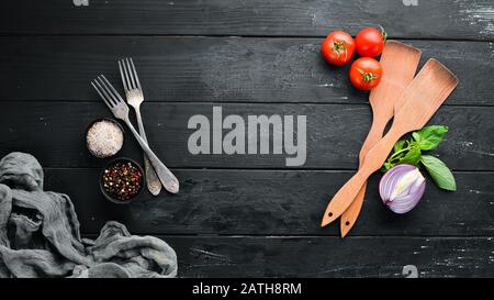 The background of cooking. Cutlery and kitchen board. Top view. Free space for your text. Rustic style. Stock Photo