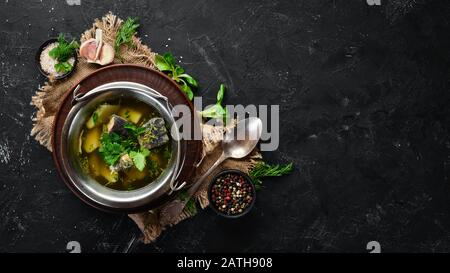 Trout fish soup. Ukrainian cuisine. Top view. Free space for your text. Rustic style. Stock Photo