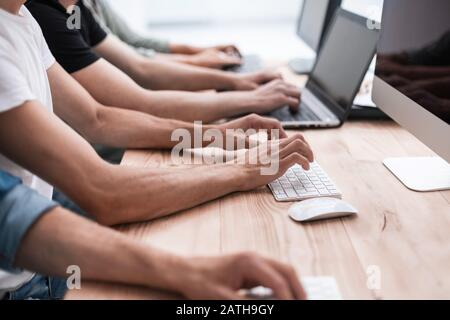 close up. colleagues work on their computers. Stock Photo