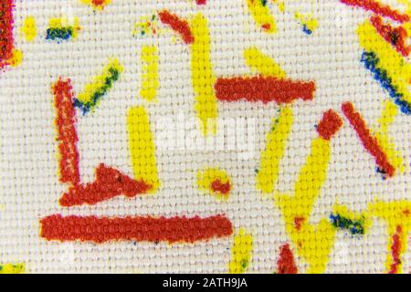 image background of white fabric with yellow red abstract pattern Stock Photo