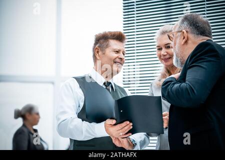 close up. experienced company employees discussing business documents Stock Photo