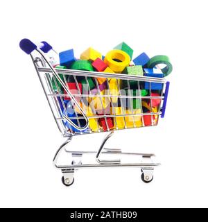 cart or shopping trolley full of wooden blocks and building bricks; , concept online shopping grocery or mall Stock Photo