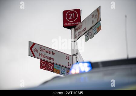 Sauerland, Germany. 03rd Feb, 2020. Sauerland, Germany. 3rd Feb, 2020. A police car is parked in front of signposts indicating the city of Menden. The search for the missing ten-year-old girl from Menden in the Sauerland region was continued by helicopter on Monday. This again takes a look at the course of the river Hönne - between Menden and the mouth of the Ruhr in the direction of Schwerte. The autistic child had walked out of the parents' apartment in an unobserved moment on Saturday - probably in pink pyjamas and barefoot. Credit: dpa picture alliance/Alamy Live News