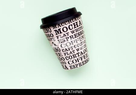Coffee cup reusable made from plants on a green background Stock Photo