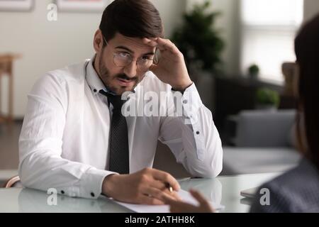 Employer looking at applicant with disbelief failed job interview concept Stock Photo