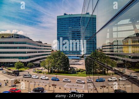 House of Bosnia and Herzegovina Parliament  and and its surroundings reflected in the glass window of  a mall. Stock Photo