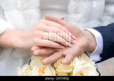 wedding theme, man and woman holding hands Stock Photo