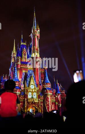 Orlando, USA - january 19, 2020: People enjoy party at disney park on castle background Stock Photo