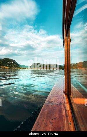 Sailing on Lake Bohinj in summer, famous travel destination in Slovenia national park Triglav seen from electric boat Stock Photo