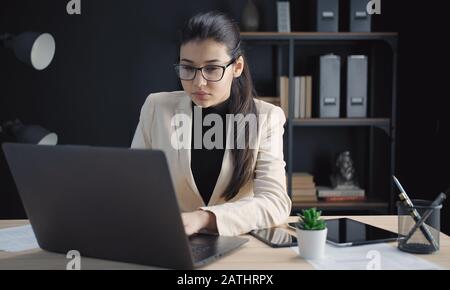 Woman working laptop in office Stock Photo