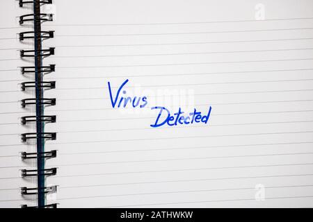 Virus detected handwriting  text on paper, on office agenda. Copy space. Stock Photo