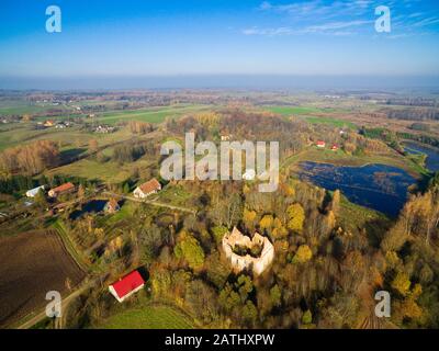 Ruins of cross shaped Lutheran church in autumn scenery, Gorne, Poland (former Gurnen, East Prussia) Stock Photo