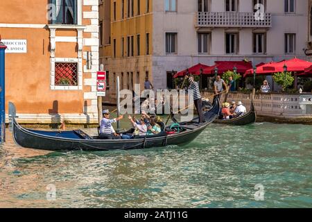 Tourists taking selfies of themselves whilst taking a gondola ride in Venice,Italy Stock Photo