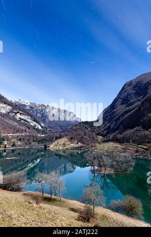 Full moon night at Lake Tenno. Trentino, Italy. Stock Photo