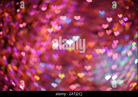 Bright multi-colored hearts bokeh lights. Beautiful valentines day background Stock Photo