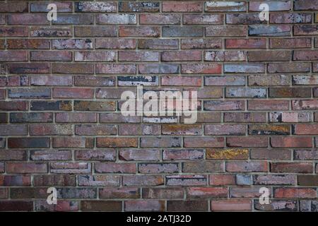 Brick wall, multi-colored decorated brick wall close-up Stock Photo