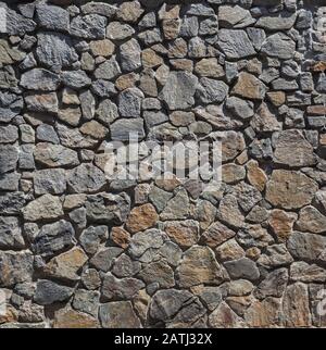 Stonewall, wall decorated with natural stone, close-up Stock Photo