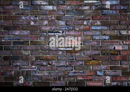Brick wall, multi-colored decorated brick wall close-up Stock Photo